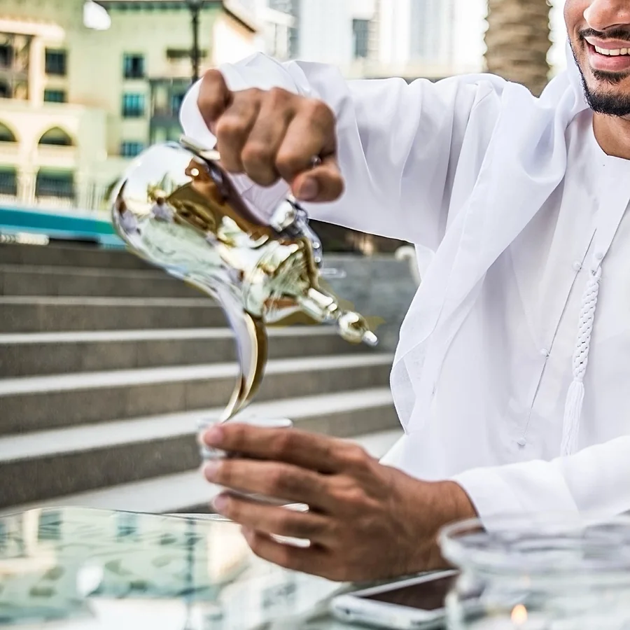 Arabic coffee poured from a dallah